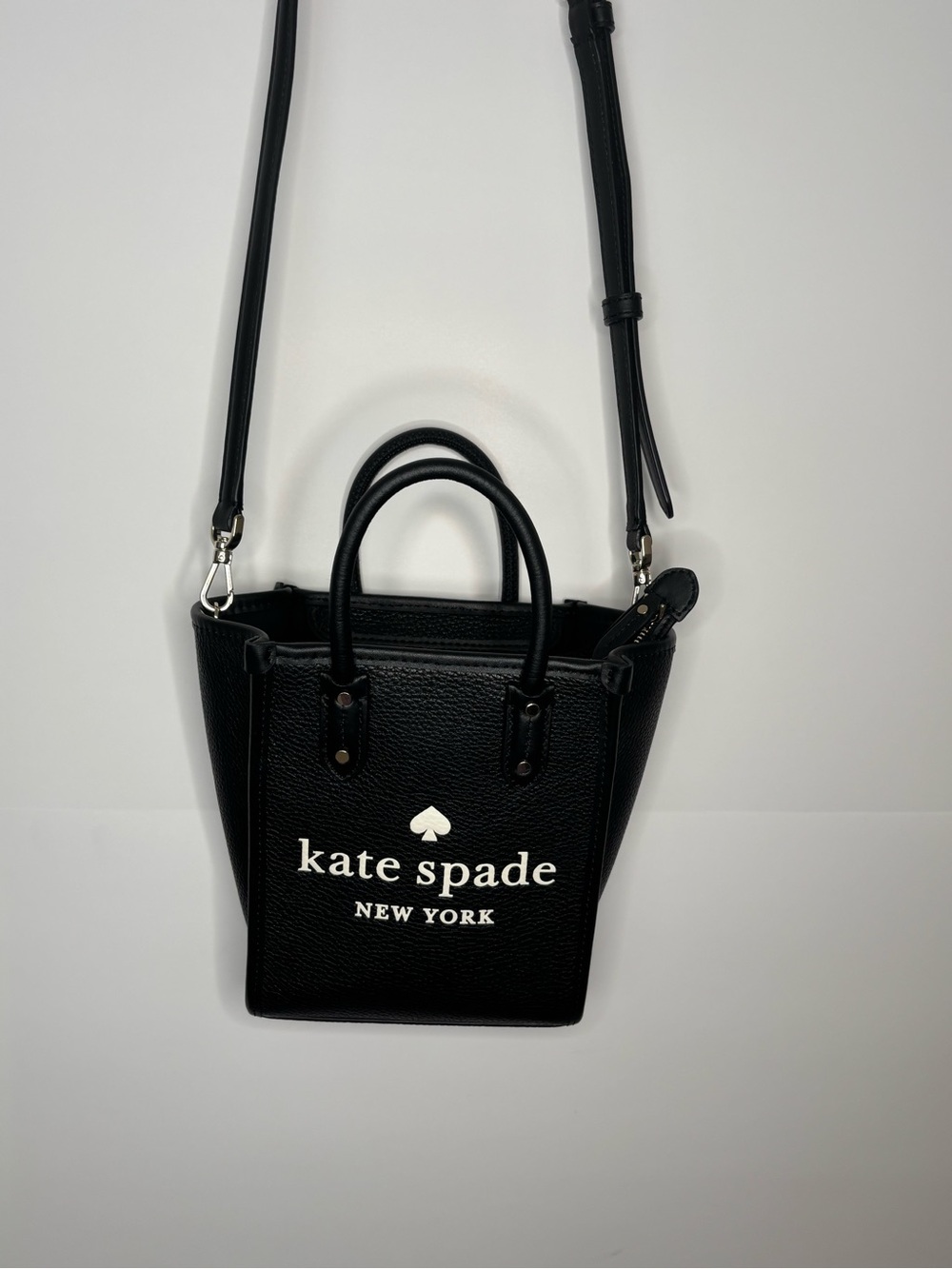 kate spade Black Pebbled Leather Small Crossbody Tote
Removable strap
